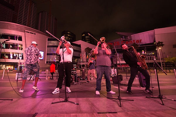 A band plays outside of STAPLES Center on Xbox Plaza.