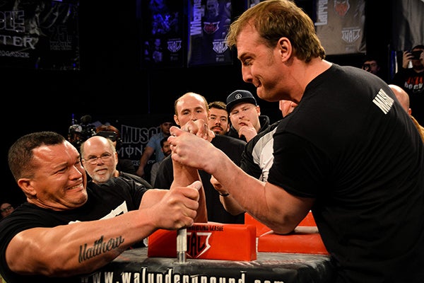 Armwrestling Lingo You Need To Know L A Live Each places one arm on a surface with their elbows bent and touching the surface, and they grip each other's hand. armwrestling lingo you need to know l