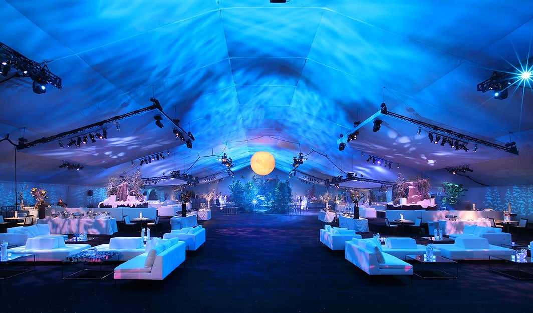 A private party setup on L.A. LIVE's event deck with blue lighting and lounge seating.